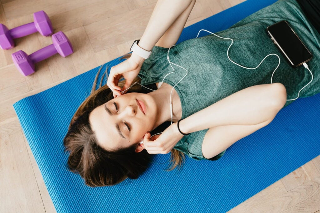 A Woman Enjoying Exercising And Listening To Music