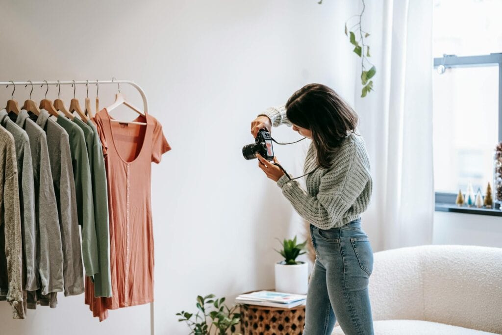Characteristics Of Creative Thinking: A Woman Taking Pictures Of Hanging Clothes.