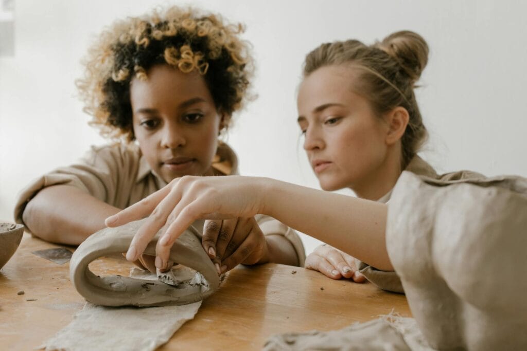 Two women doing pottery