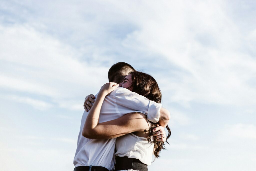 A couple hugging tightly.
