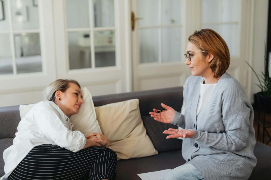 One woman is talking and the other is listening - 11 Tips On How To Be A Better Listener In A Relationship