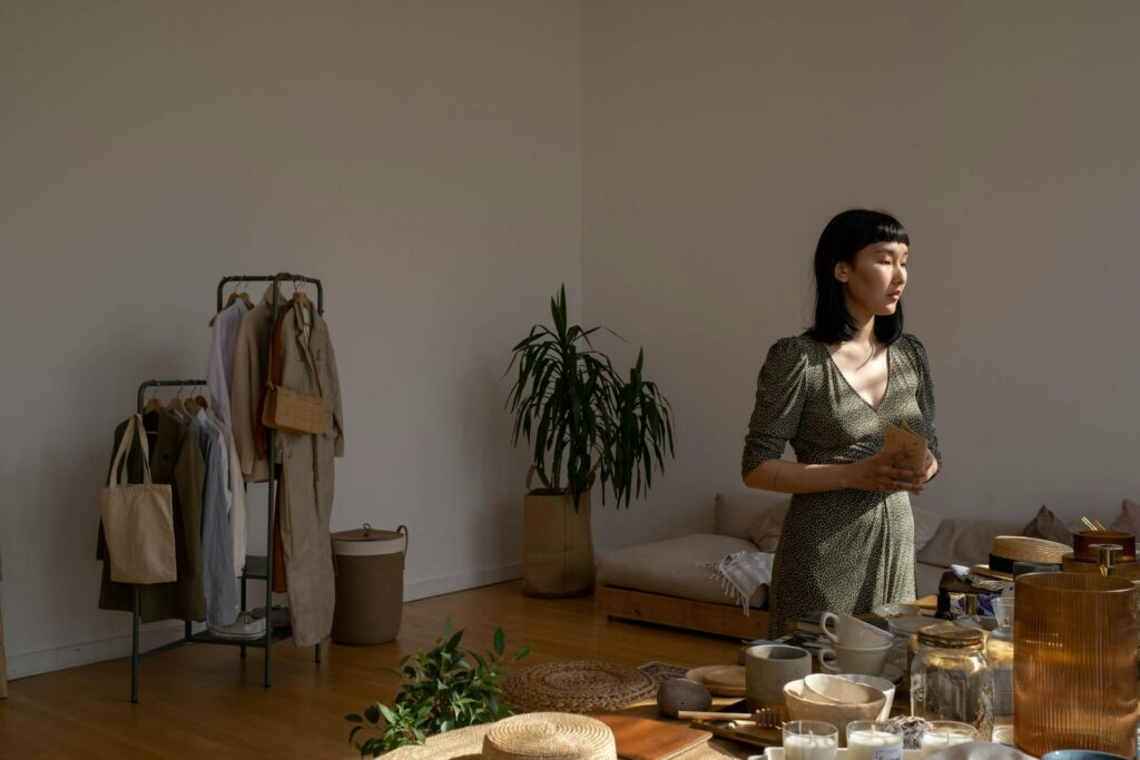 How To Get My Life Together: 10 Essential Tips For Powerful Change - a photo of A woman is in a room with a table loaded with items.