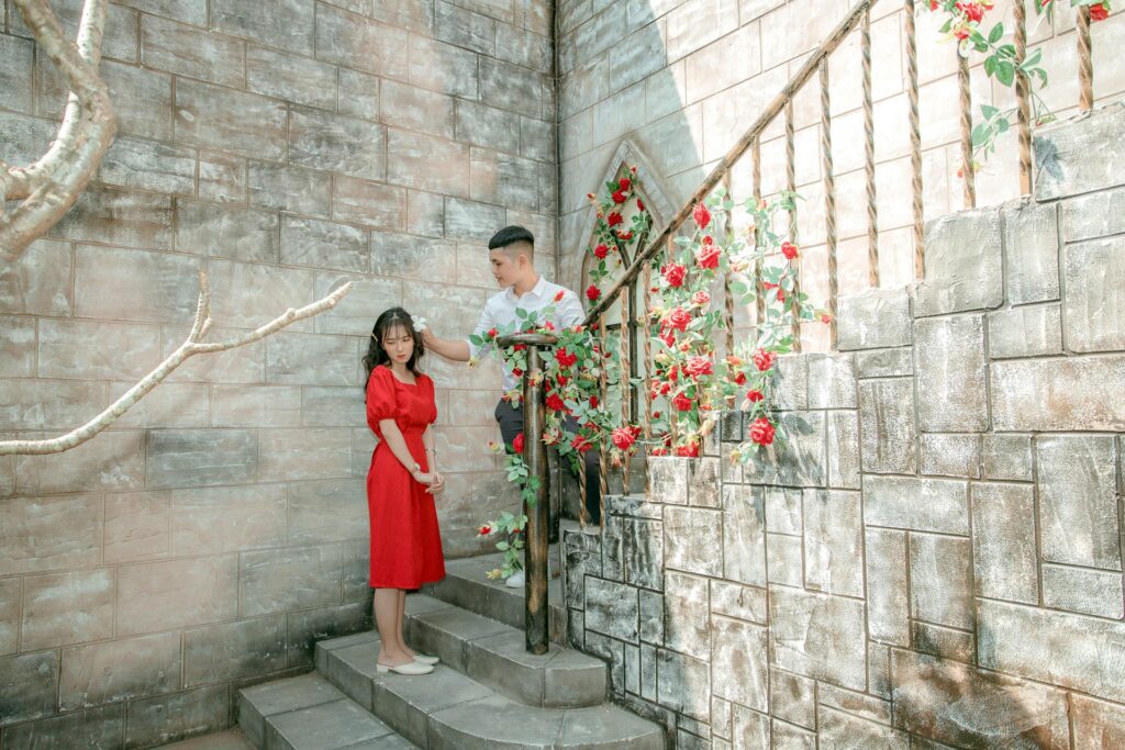 Unhealthy Boundaries In Relationships: Signs And Solutions - in photo: A man putting a flower in a woman's hair.
