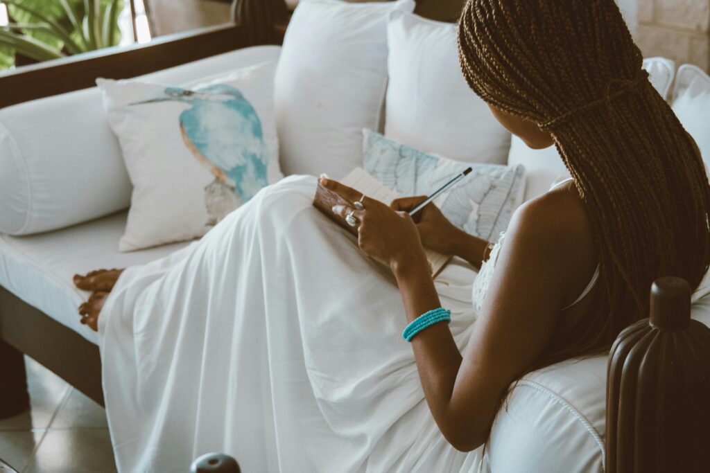 Woman journaling - Journal Prompts For Feeling Overwhelmed