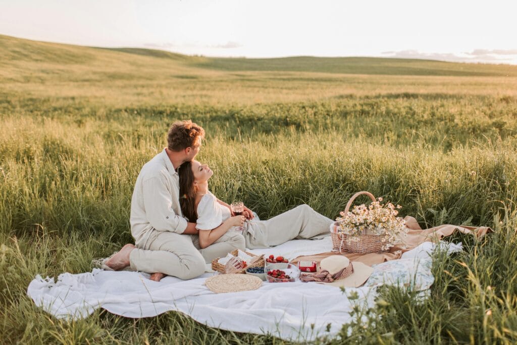 Couple having a romantic picnic together - How To Communicate Your Needs In A Relationship Effectively