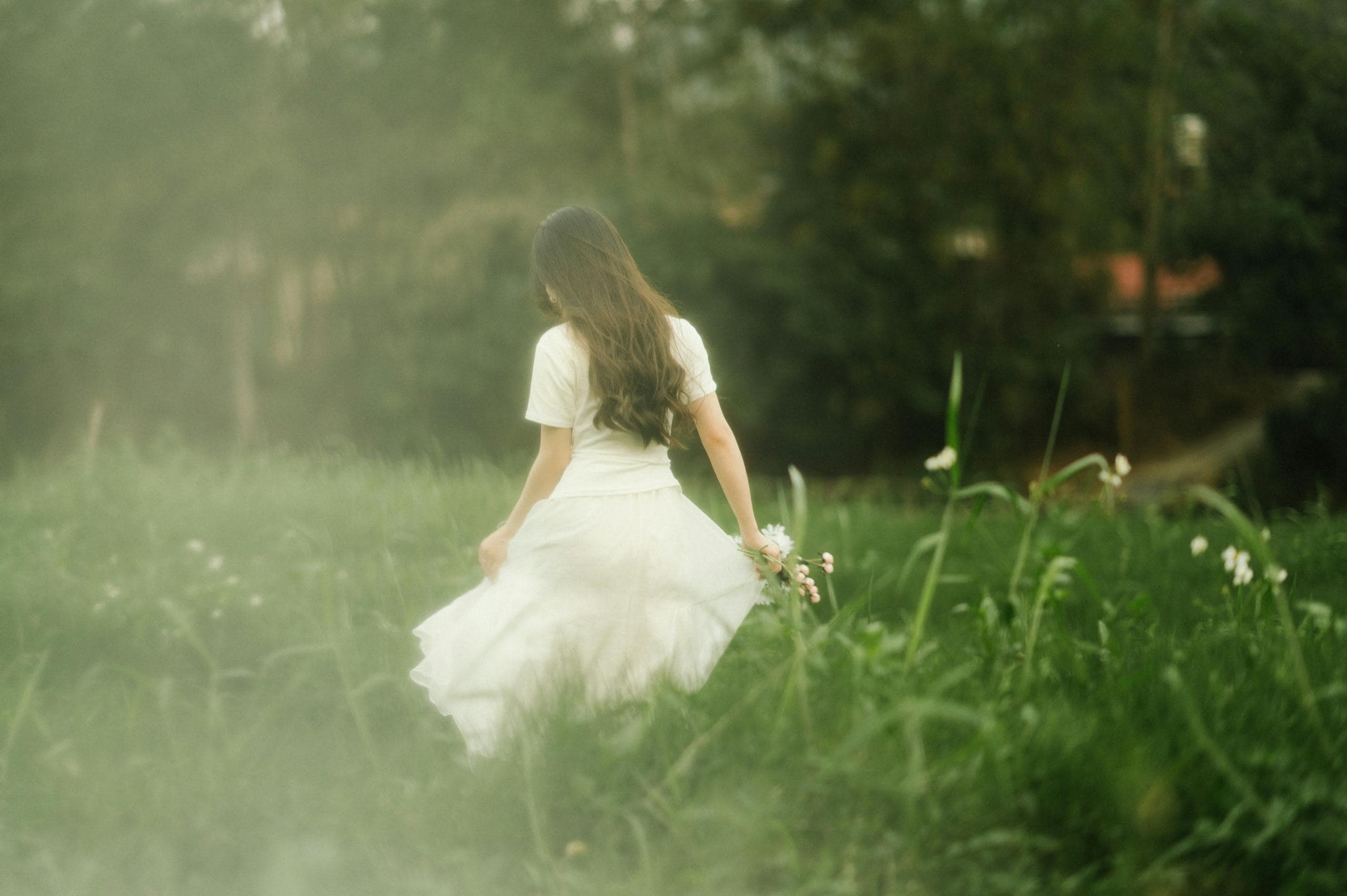 Woman walking in a serene meadow in Lạng Sơn, Vietnam. Fashion photography with a soft, dreamy mood. - How To Heal Emotional Wounds: Practical Steps To Feel Relief